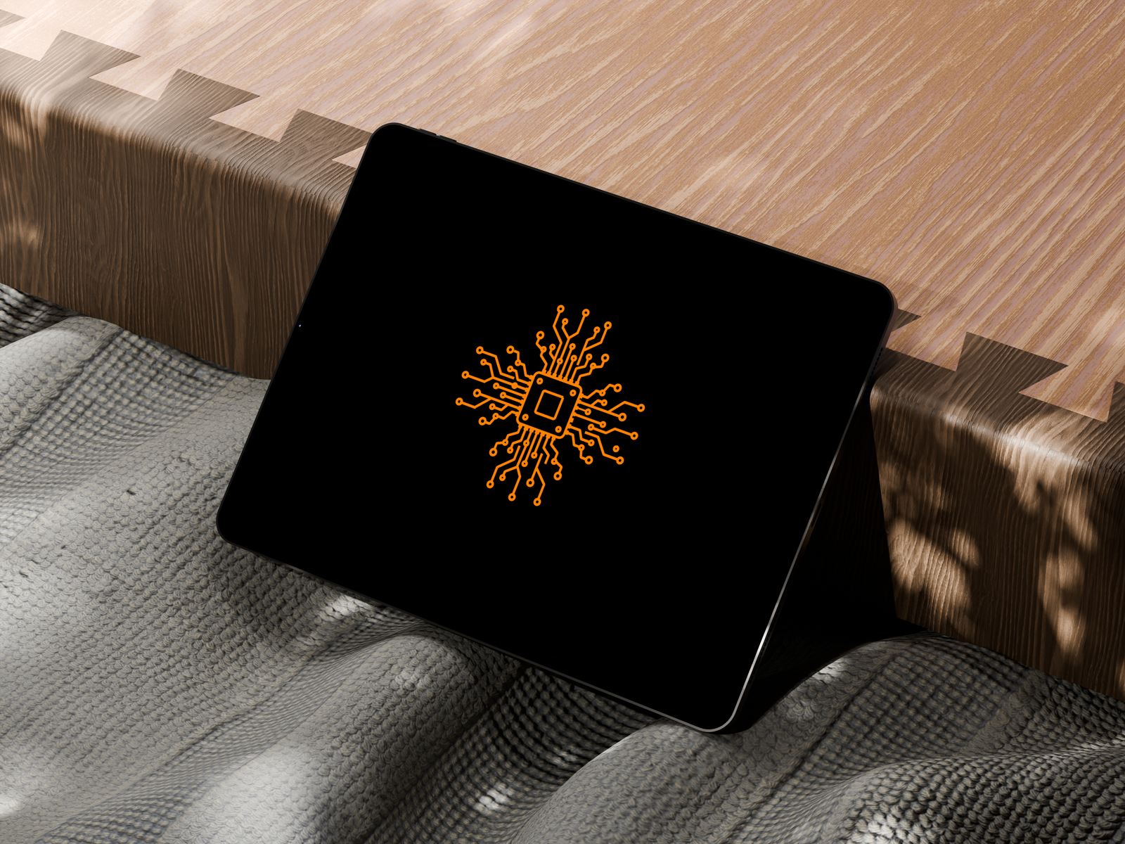 Chip mark on an iPad, on textured fabric and wood